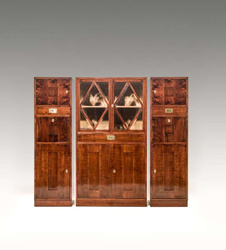 SCHOOL OF PROF. JOSEF HOFFMANN
WIENER KUNST IM HAUS

SUITE OF THREE CABINETS
consisting of: 1 glass-fronted cabinet, a pair of mirrored cabinets
